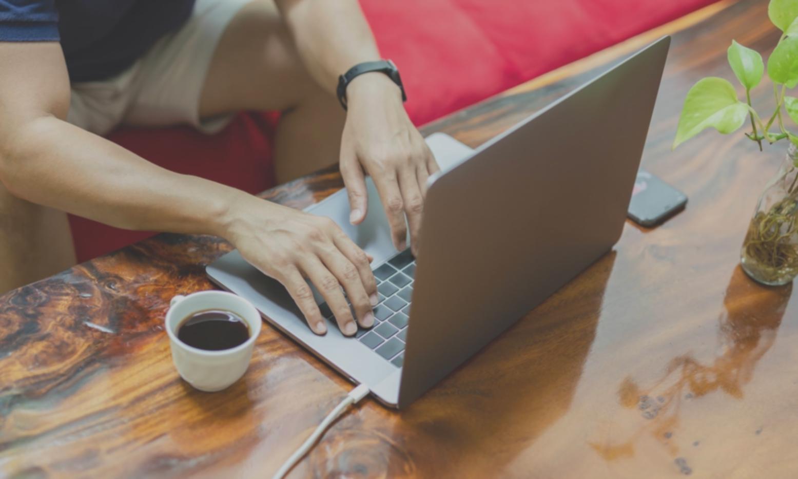 Mobile app development team working on code updates and testing across multiple devices