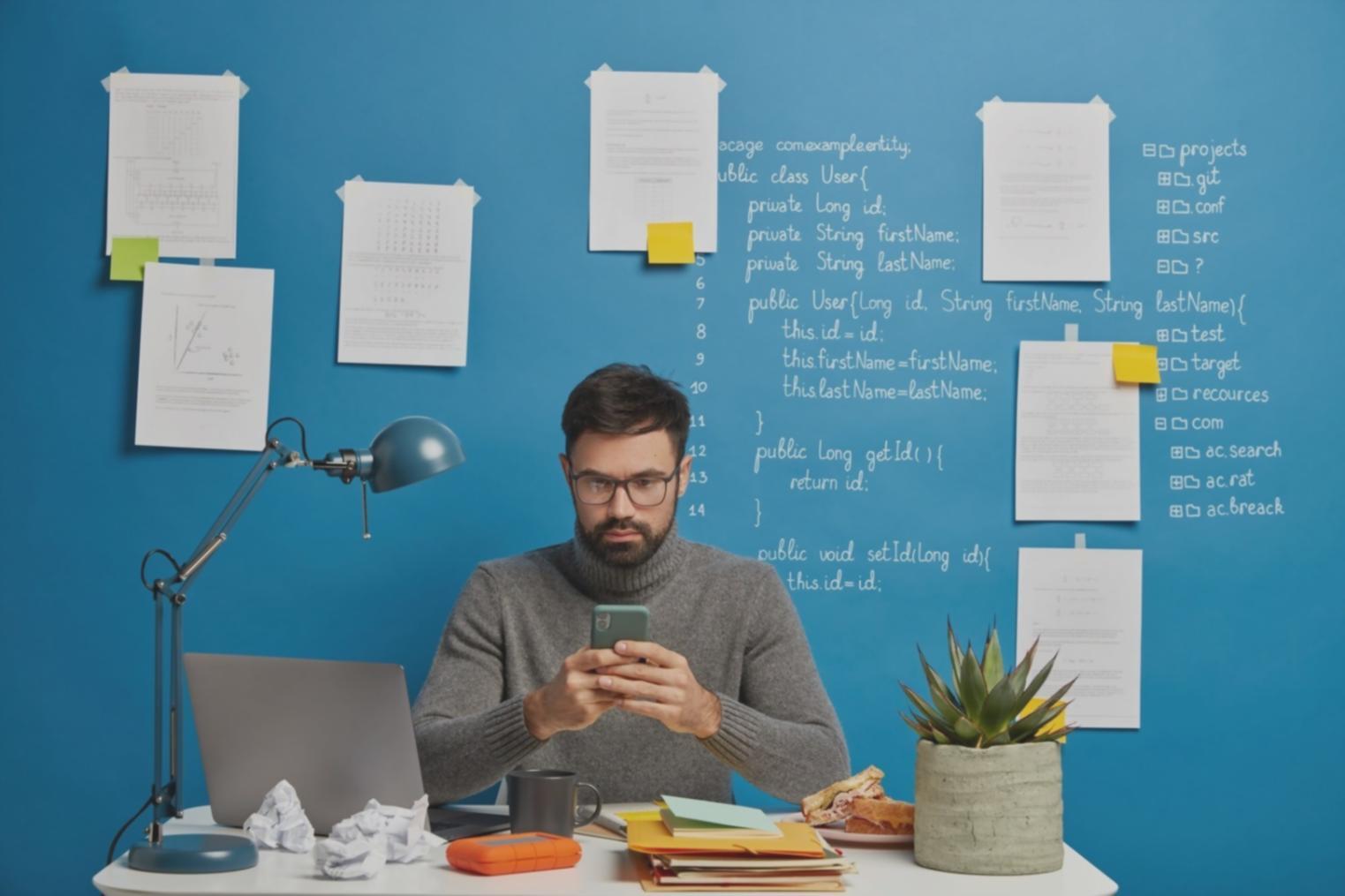 Students working on mobile app development projects